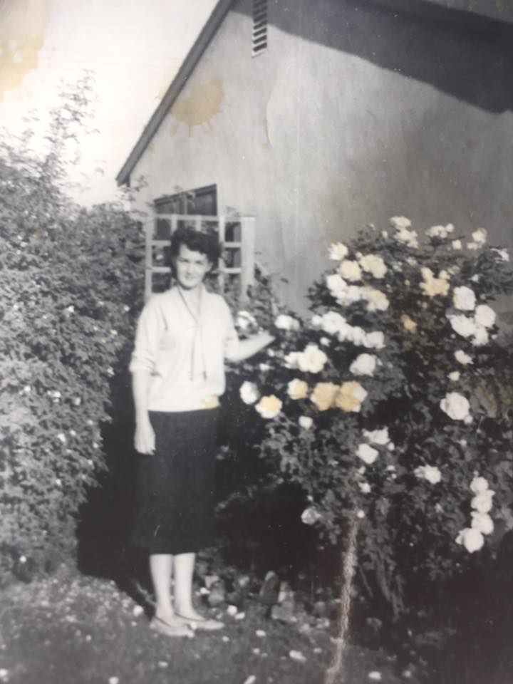 Evelyn standing in front of her roses at her home in Southern California, circa 1945.